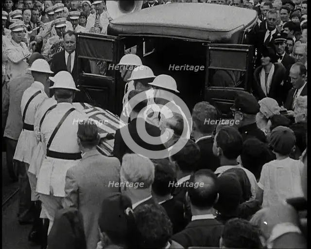 Male American Soldiers in White Uniforms Taking the Coffin of Anton Cermak, the Mayor of..., 1933. Creator: British Pathe Ltd.