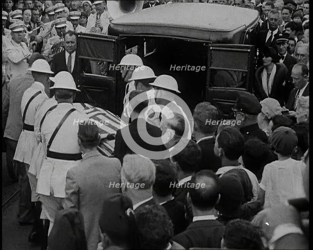 Male American Soldiers in White Uniforms Taking the Coffin of Anton Cermak, the Mayor of..., 1933. Creator: British Pathe Ltd.