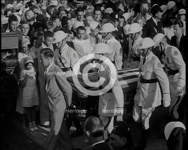 Male American Soldiers in White Uniforms Carrying the Coffin of Anton Cermak, the Mayor of..., 1933. Creator: British Pathe Ltd.