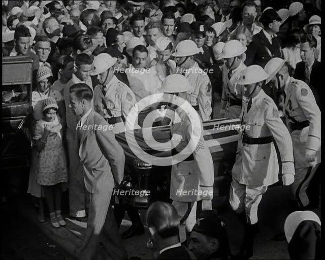 Male American Soldiers in White Uniforms Carrying the Coffin of Anton Cermak, the Mayor of..., 1933. Creator: British Pathe Ltd.