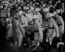 Male American Soldiers in White Uniforms Carrying the Coffin of Anton Cermak, the Mayor of..., 1933. Creator: British Pathe Ltd