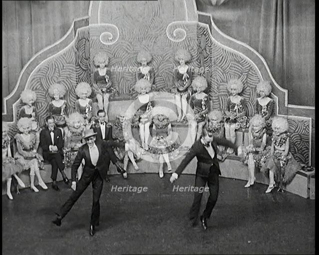 Male and Female Actors in Costumes Performing a Dance Routine On Stage, 1920s. Creator: British Pathe Ltd.