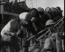 Male British Expeditionary Force Solders With Their Packs Walking up a Gangplank Past..., 1939. Creator: British Pathe Ltd