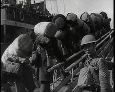 Male British Expeditionary Force Solders With Their Packs Walking up a Gangplank Past..., 1939. Creator: British Pathe Ltd