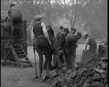 Male Civilian Volunteers Shovelling Heaps of Coal in Hyde Park London, 1926. Creator: British Pathe Ltd