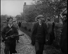 Male Civilian Being Arrested and Escorted Along a Country Lane by a Police Officer, 1920s. Creator: British Pathe Ltd