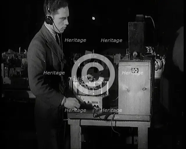 Male Civilian Building a Radio Wireless Set in a Factory, 1931. Creator: British Pathe Ltd.