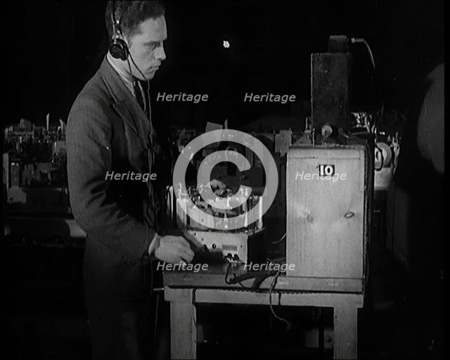 Male Civilian Building a Radio Wireless Set in a Factory, 1931. Creator: British Pathe Ltd.
