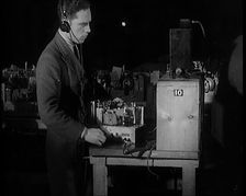 Male Civilian Building a Radio Wireless Set in a Factory, 1931. Creator: British Pathe Ltd