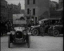 Male Civilian Driving a Car Out of a Parking Space On the Streets of London Watched By..., 1920s. Creator: British Pathe Ltd