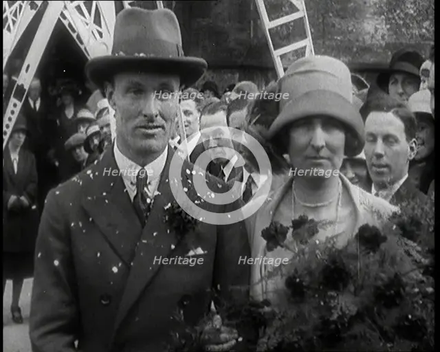 Male Civilian (Groom) And Female Civilian (Bride) Emerging from a Church To Walk Through an...,1927 Creator: British Pathe Ltd.