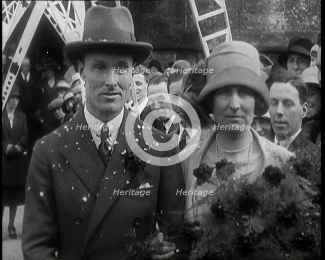 Male Civilian (Groom) And Female Civilian (Bride) Emerging from a Church To Walk Through an...,1927 Creator: British Pathe Ltd.