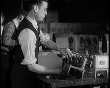Male Civilians Building Radio Wireless Sets in a Factory, 1931. Creator: British Pathe Ltd