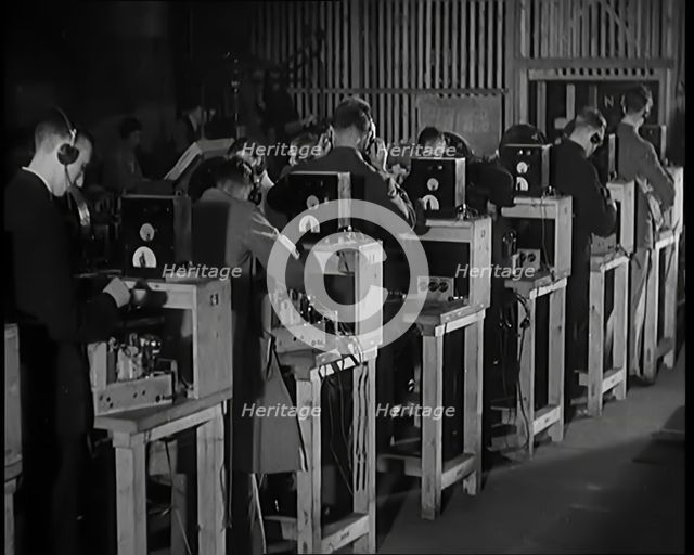 Male Civilians Building Radio Wireless Sets in a Factory, 1931. Creator: British Pathe Ltd.
