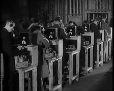 Male Civilians Building Radio Wireless Sets in a Factory, 1931. Creator: British Pathe Ltd