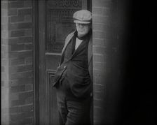 Male Civilians Standing in the Streets, 1926. Creator: British Pathe Ltd