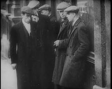 Male Civilians Standing in the Streets, 1926. Creator: British Pathe Ltd