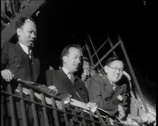 Male Civilians Watching a Female Civilian in Traditional Robe Performing With Sabres in..., 1932. Creator: British Pathe Ltd