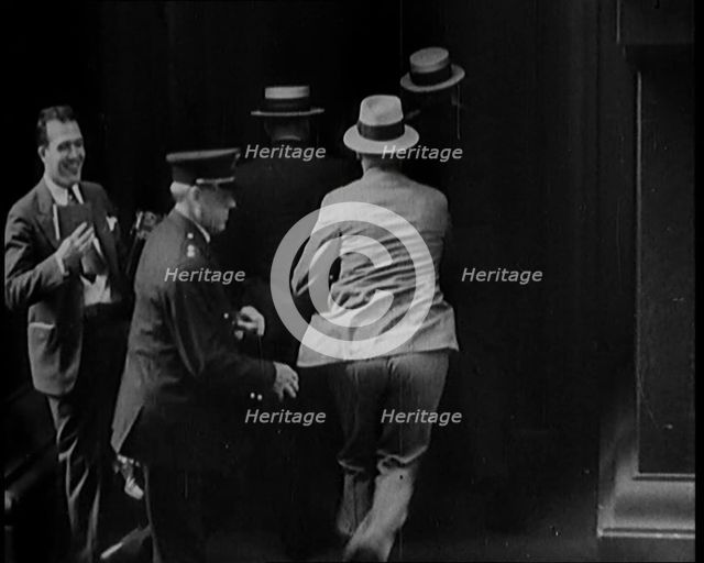 Male Civilians Walking in to a Building, 1929. Creator: British Pathe Ltd.
