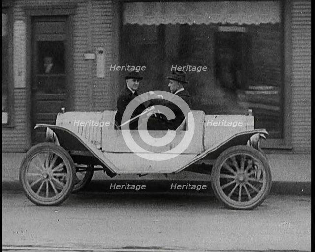 Male Civilians Test Driving the Two Way Car Which Has Two Steering Wheels and Can Be Driven..., 1929 Creator: British Pathe Ltd.