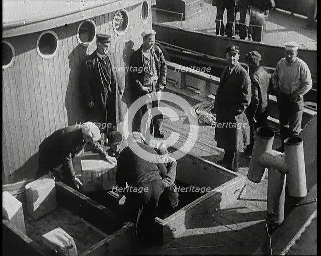 Male Civilians Unloading Illegal Cargo from a Boat, 1932. Creator: British Pathe Ltd.