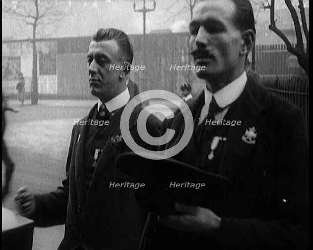 Male Ex-Services Civilians Playing a Hurdy-Gurdy For Money in the Street, 1920s. Creator: British Pathe Ltd.