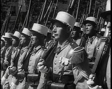 Male French Foreign Legion Soldiers Marching in a Bastille Day Military Parade, 1939. Creator: British Pathe Ltd
