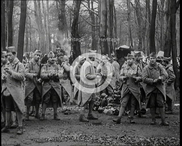 Male French Soldier Stand in a Wood Eating, 1924. Creator: British Pathe Ltd.