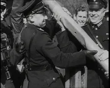 Male German Officers Removing a Barrier at a Checkpoint on the Border Between Germany and..., 1938. Creator: British Pathe Ltd