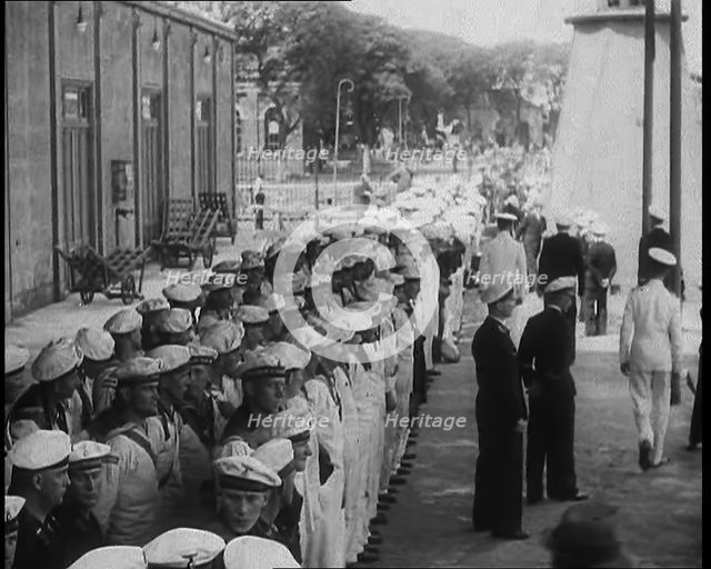 Male German Navy Crew Lined up in Front of a Building in Montevideo, 1939. Creator: British Pathe Ltd.
