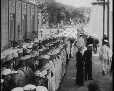 Male German Navy Crew Lined up in Front of a Building in Montevideo, 1939. Creator: British Pathe Ltd