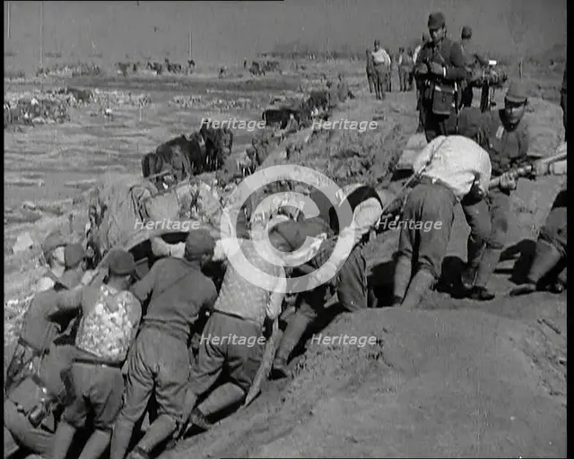 Male Japanese Soldiers Hauling a Cart up a Beach Near Shanghai, 1937. Creator: British Pathe Ltd.
