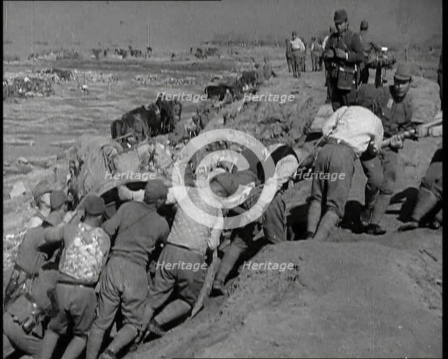 Male Japanese Soldiers Hauling a Cart up a Beach Near Shanghai, 1937. Creator: British Pathe Ltd.