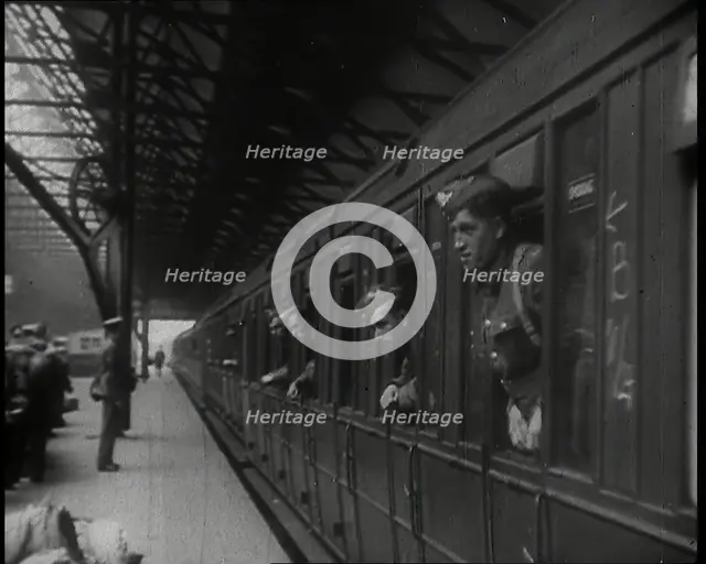 Male Members of the British Expeditionary Force Leaning Out of the Carriages as a Train is..., 1939. Creator: British Pathe Ltd.