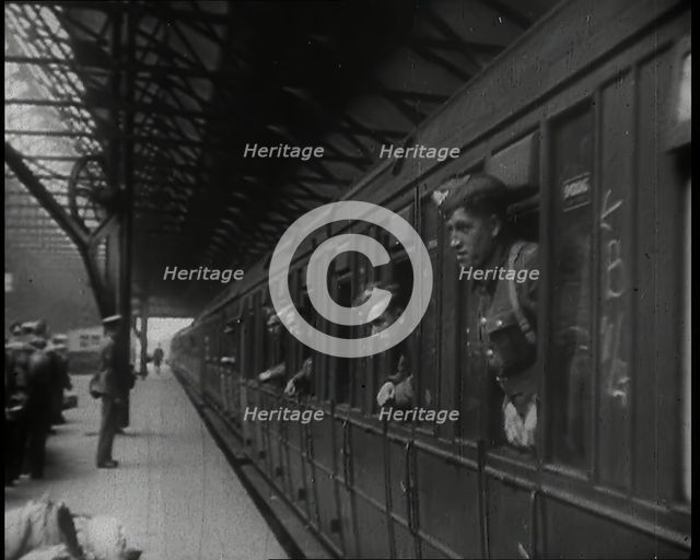 Male Members of the British Expeditionary Force Leaning Out of the Carriages as a Train is..., 1939. Creator: British Pathe Ltd.