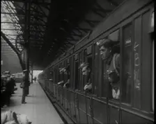 Male Members of the British Expeditionary Force Leaning Out of the Carriages as a Train is..., 1939. Creator: British Pathe Ltd