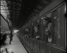 Male Members of the British Expeditionary Force Leaning Out of the Carriages as a Train is..., 1939. Creator: British Pathe Ltd