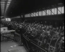 Male Members of the British Expeditionary Force Waiting at a Large Railway Station Before..., 1939. Creator: British Pathe Ltd