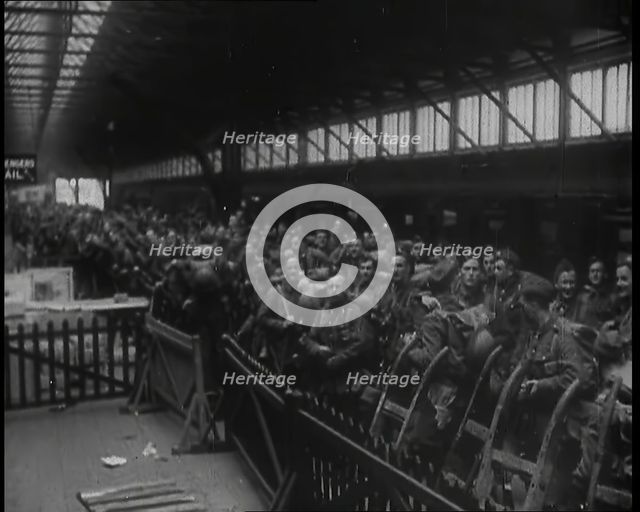 Male Members of the British Expeditionary Force Waiting at  a Large Railway Station Before..., 1939. Creator: British Pathe Ltd.