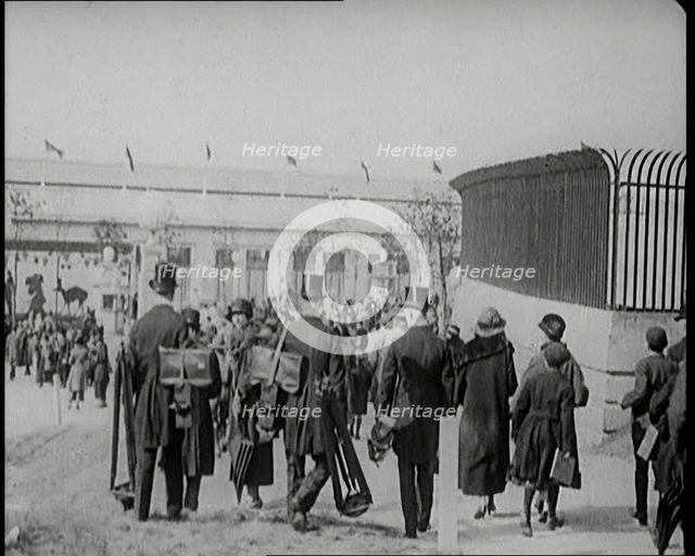 Male Newsreel Camera Operators Carrying Tripods and Equipment, 1920s. Creator: British Pathe Ltd.