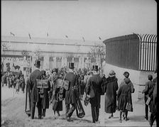 Male Newsreel Camera Operators Carrying Tripods and Equipment, 1920s. Creator: British Pathe Ltd