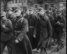 Male Polish Soldiers Walking Along a Warsaw Street, 1939. Creator: British Pathe Ltd