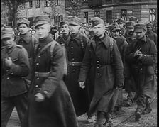Male Polish Soldiers Walking Along a Warsaw Street, 1939. Creator: British Pathe Ltd