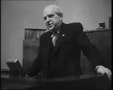 Male Representative of the League of Nations Speaking at Lectern in Front of Microphone, 1937. Creator: British Pathe Ltd