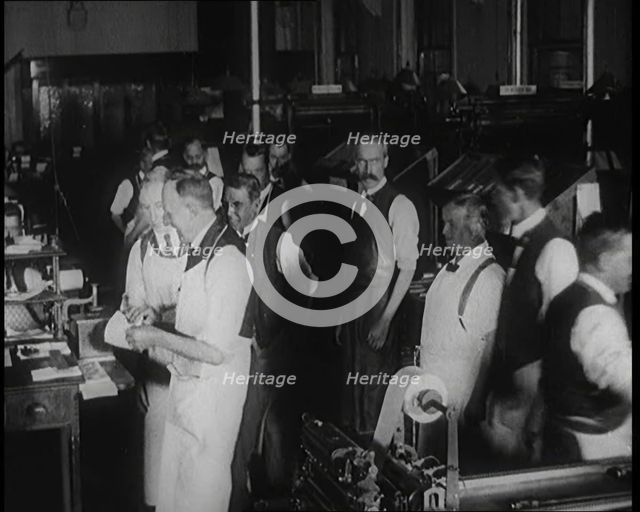 Male Screen Printers Working in a News Room, Using Various Pieces of Printing Machinery, 1921. Creator: British Pathe Ltd.