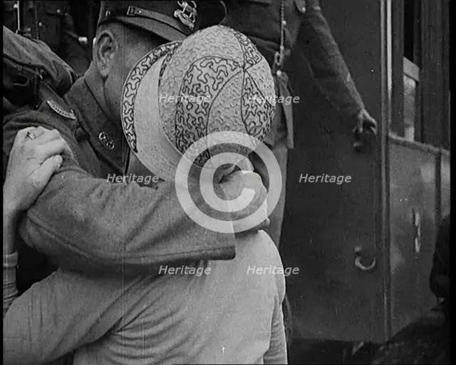 Male Soldier Kissing Female Civilian before boarding a Train, 1929. Creator: British Pathe Ltd.