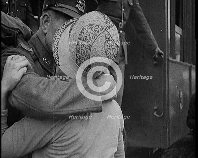 Male Soldier Kissing Female Civilian before boarding a Train, 1929. Creator: British Pathe Ltd.
