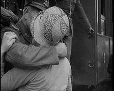 Male Soldier Kissing Female Civilian before boarding a Train, 1929. Creator: British Pathe Ltd