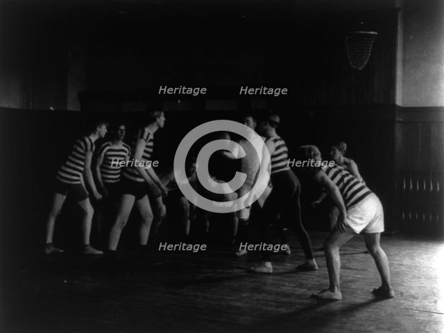 Male students playing basketball, Western High School, Washington, D.C., (1899?). Creator: Frances Benjamin Johnston.