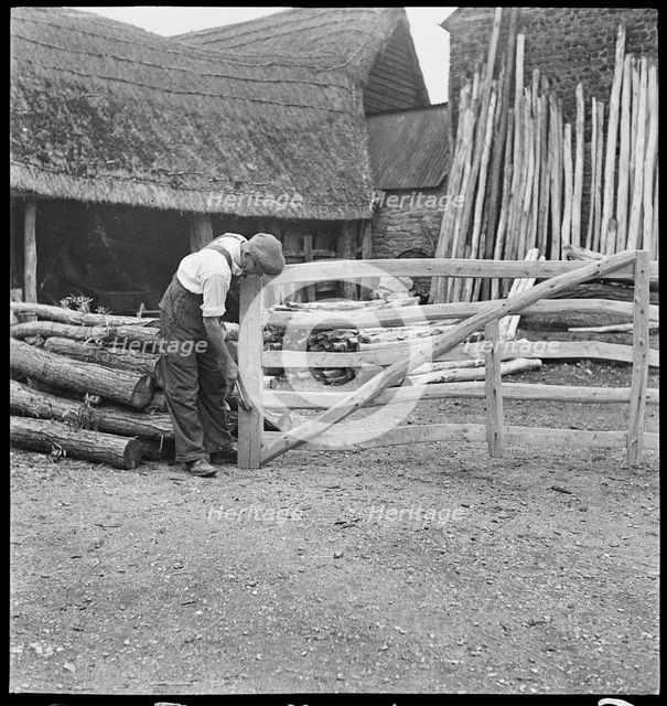 Man making a field gate in the village of Aston, Cote, Shifford and Chimney, Oxfordshire, 1930-50. Creator: George R Long.